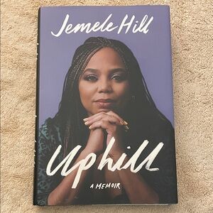 Jenelle Hill, uphill a memoir. Heard cover book. In like new condition.